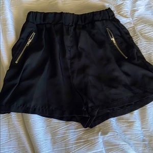 Black shorts with silver zippers